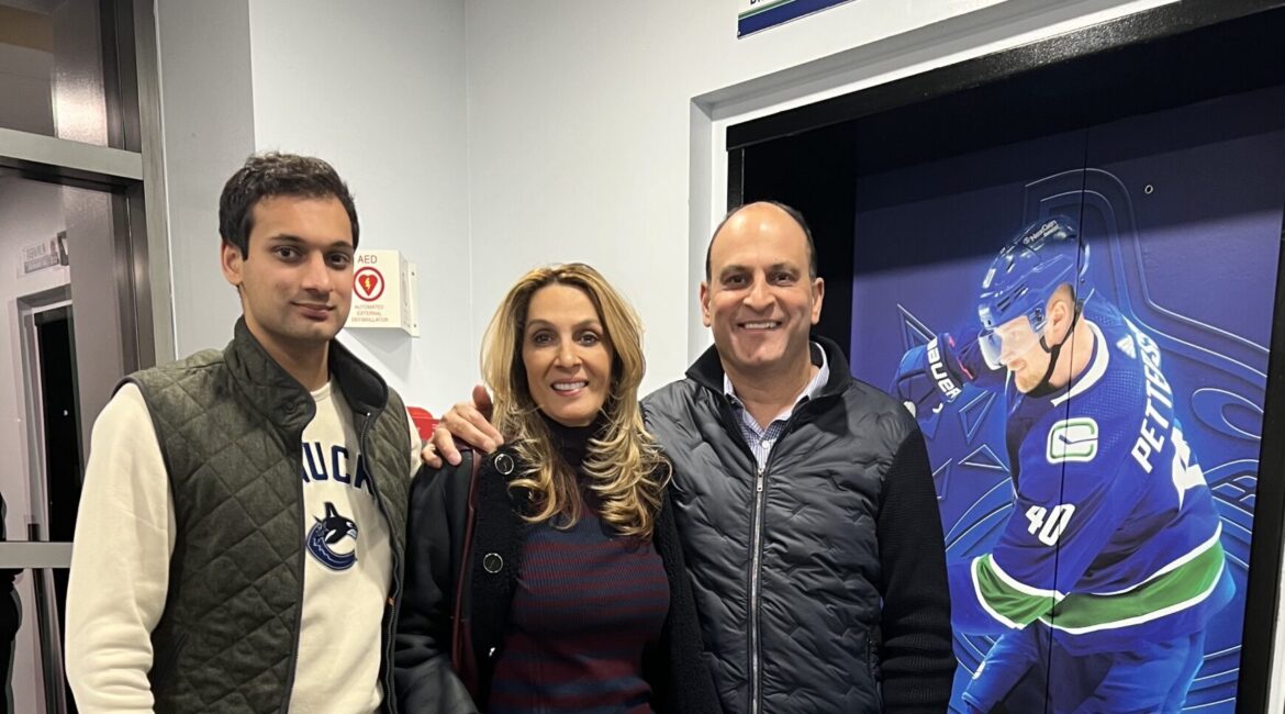 David Sidoo enjoying the Vancouver Canucks game, supporting youth sports and community engagement.